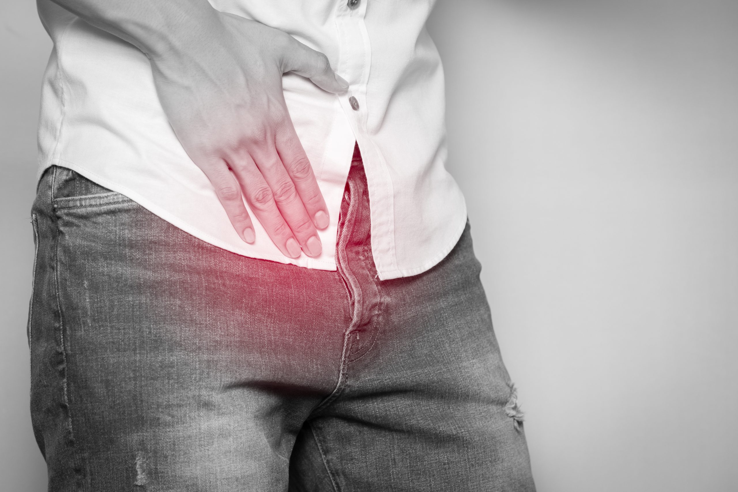 Male hands holding on middle crotch of trousers with prostate inflammation, Prostate cancer, Men's health care concept.